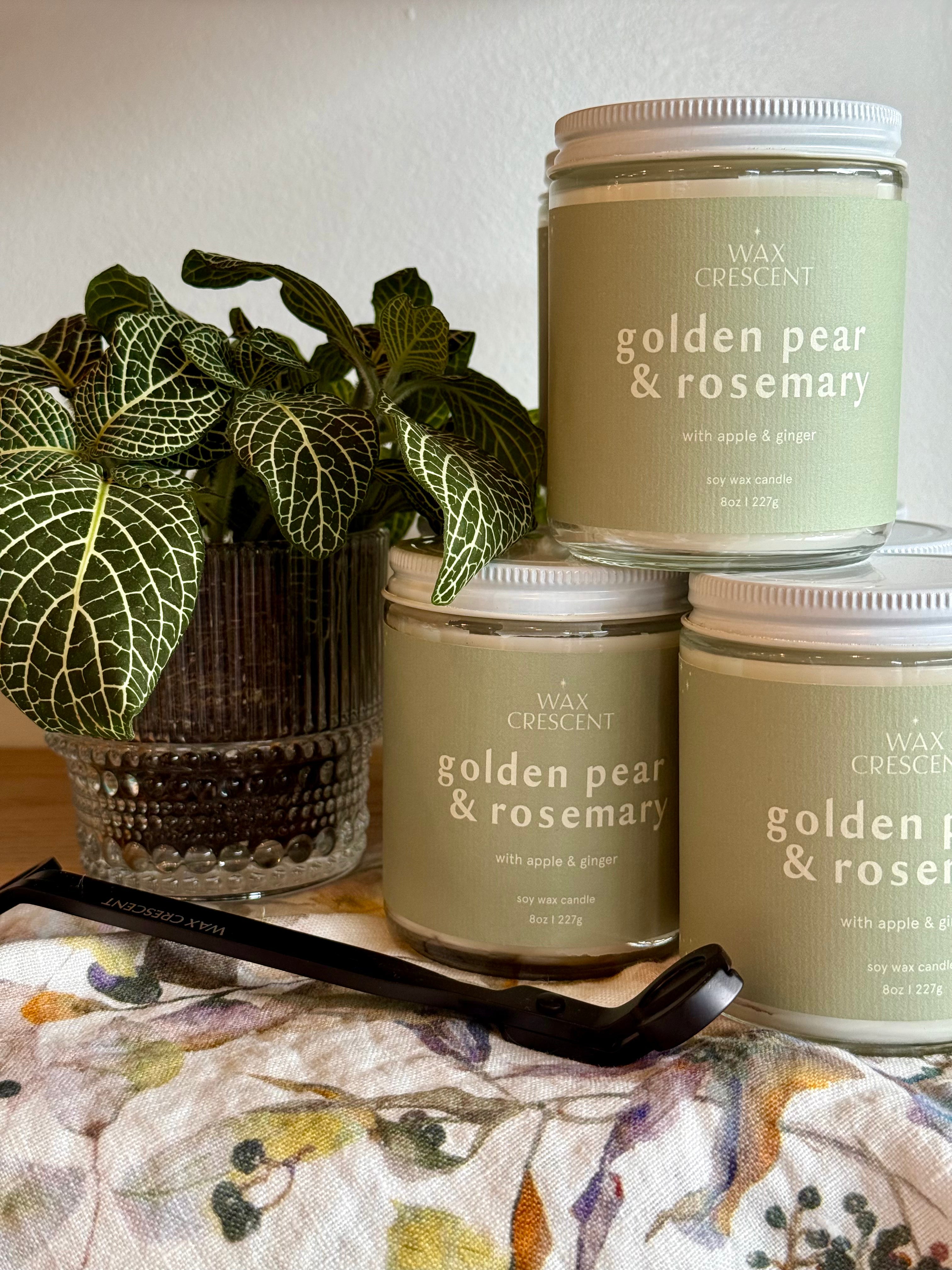 golden pear & rosemary fall candle stack of three sitting in Wax Crescent store