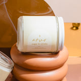 Aesthetic product photo of Wax Crescent’s Aries candle featuring minimalist astrology design and warm-toned backdrop