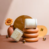 Luxury Aries astrology candle with illustrated label and smoke curling in the background, styled for modern home decor