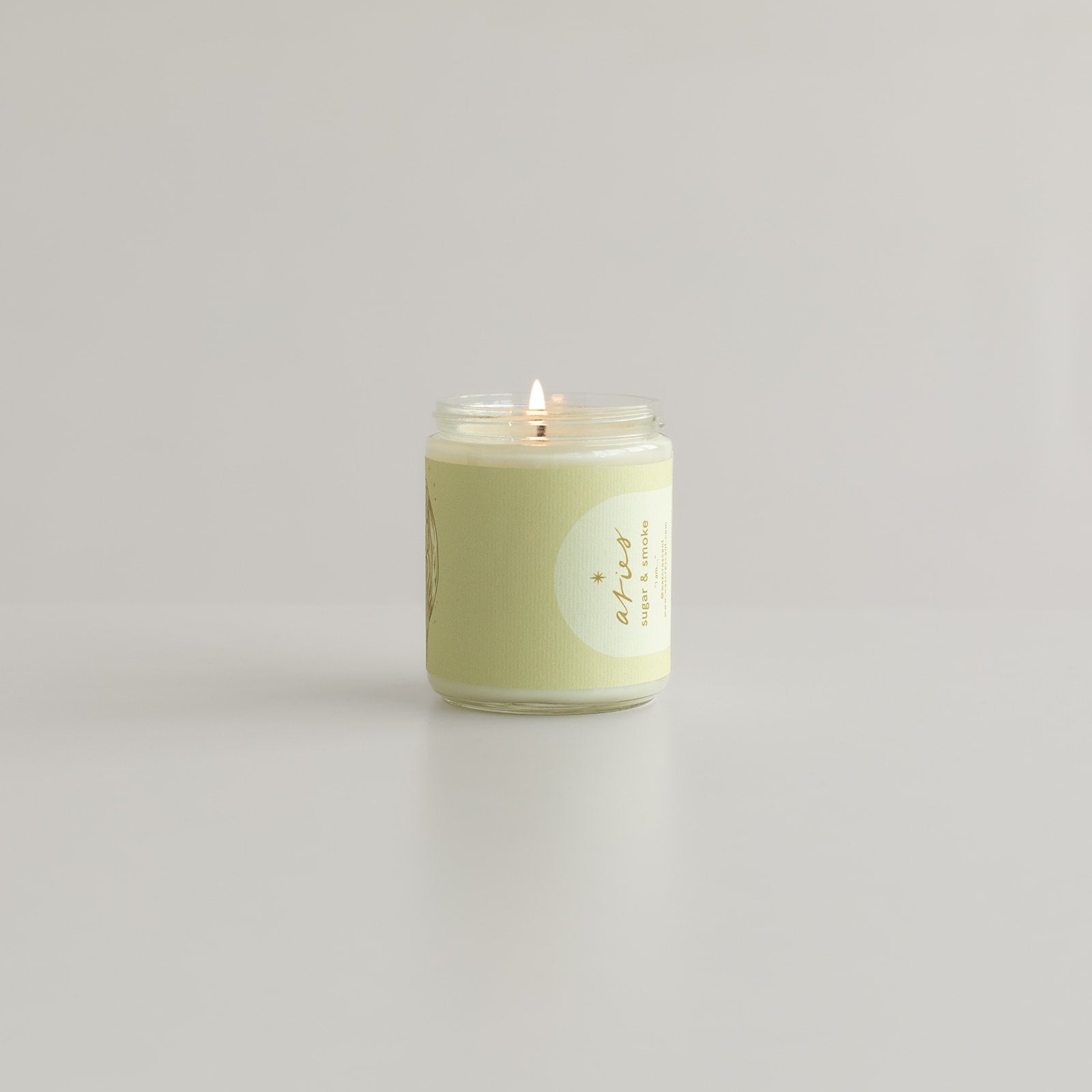 Side view of the Aries Zodiac candle by Wax Crescent, featuring a sleek, minimalist design in a clear glass jar. This luxury soy wax candle is clean-burning and ideal for self-care routines or as a zodiac-themed gift for Aries.