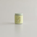 Top view of the lit Aries Zodiac candle, hand-poured with botanical scents, capturing its smooth, creamy wax and minimalist design. A perfect home accent for astrology lovers and fans of eco-conscious, non-toxic candles.