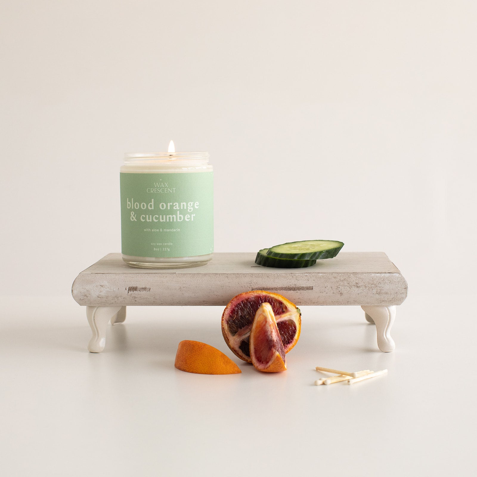 soy wax candle scented in blood orange and cucumber with nontoxic ingredients