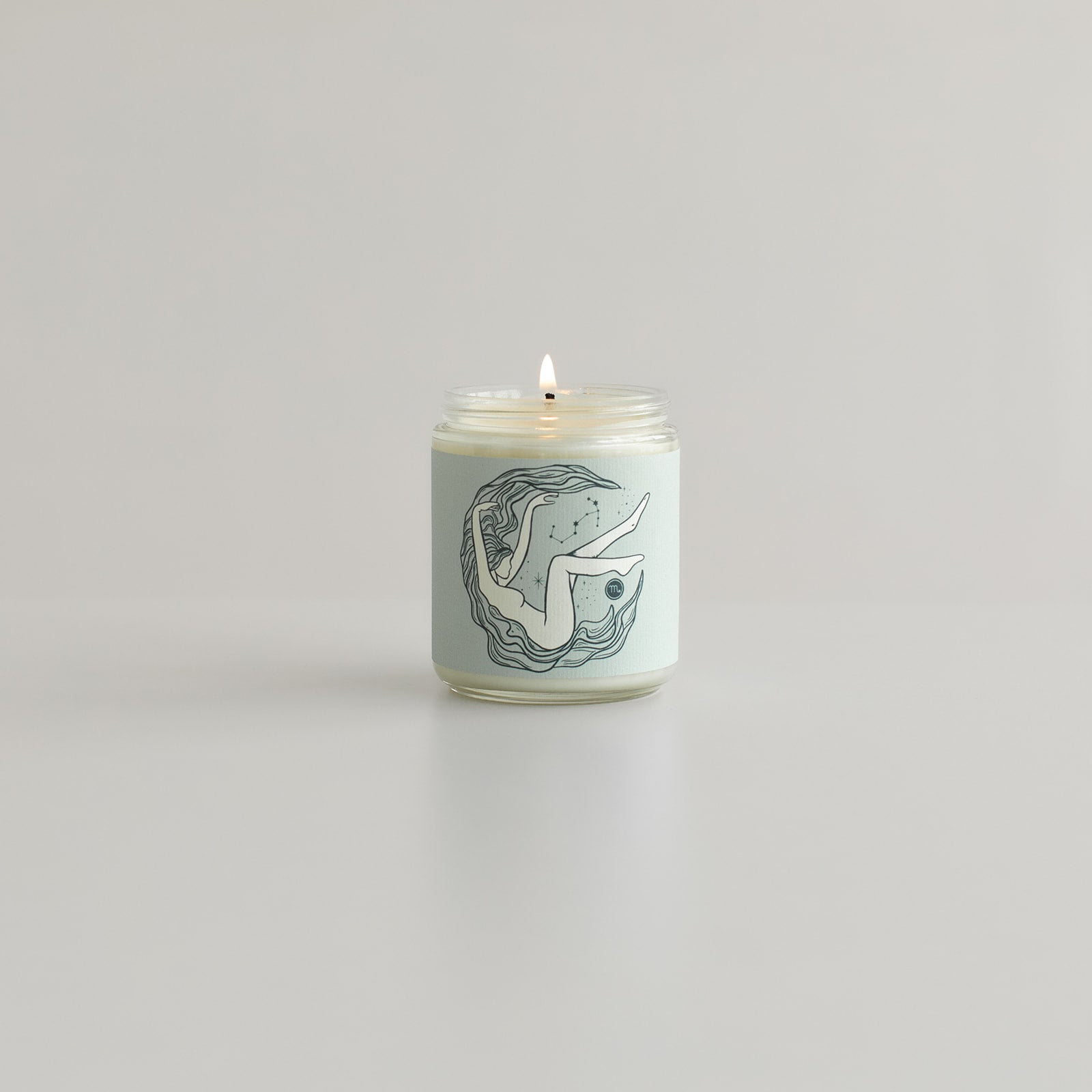 scorpio astrology zodiac candle with scorpio glyph and goddess woman on candle jar 