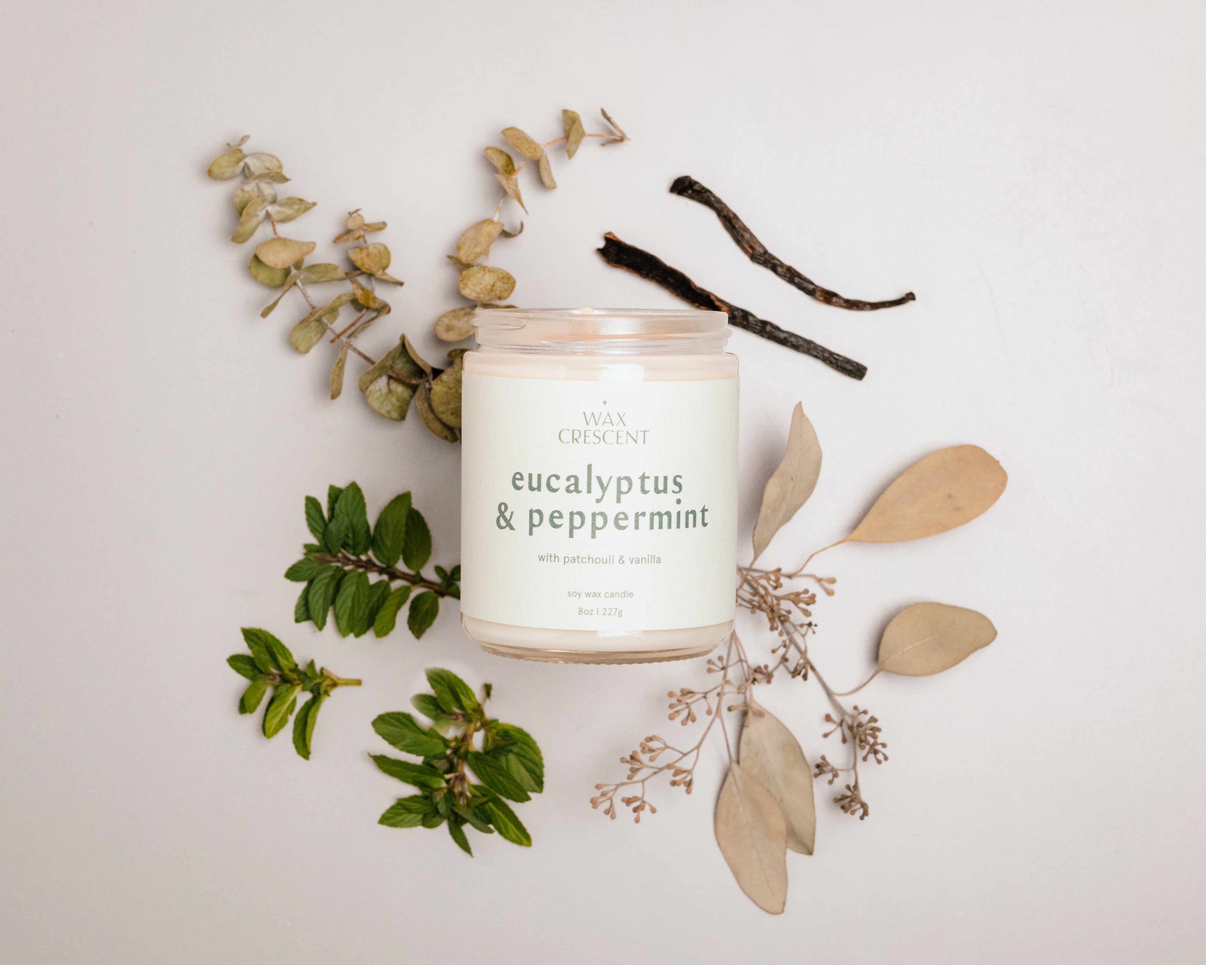 Eco-friendly Eucalyptus & Peppermint soy wax candle by Wax Crescent, made with non-toxic fragrance oils and a cotton core wick for a clean, long-lasting burn.