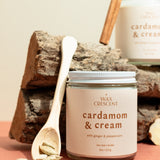 Cardamom & Cream candles styled with cinnamon and cardamom on wood — elegant non-toxic holiday candles hand-crafted by Wax Crescent, the perfect cozy gift for the season.