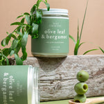 Olive Leaf & Bergamot candles styled with olive branches — elegant non-toxic holiday candles hand-poured by Wax Crescent, the perfect clean fragrance gift for the season