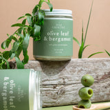 Olive Leaf & Bergamot candles styled with olive branches — elegant non-toxic holiday candles hand-poured by Wax Crescent, the perfect clean fragrance gift for the season