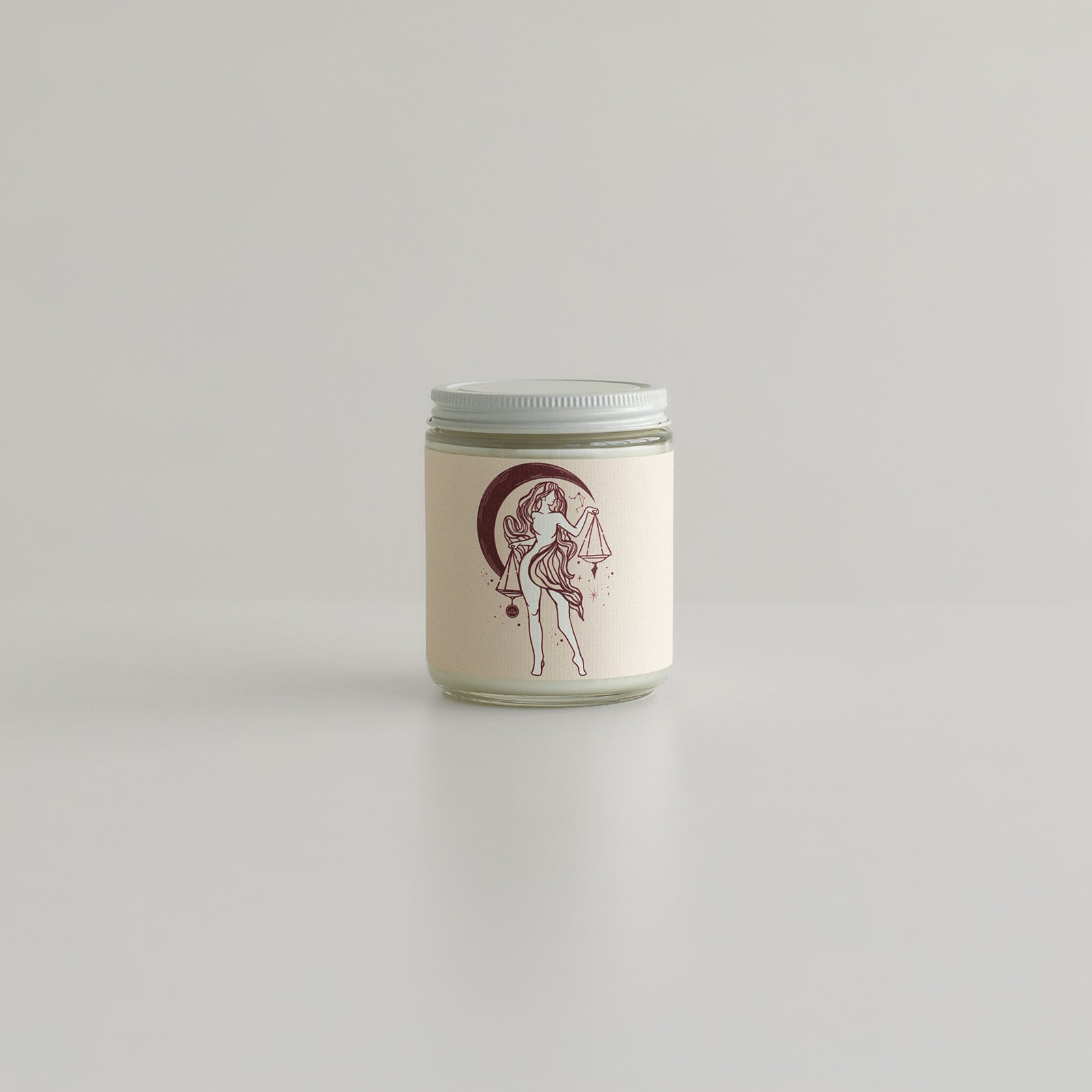 astrology libra candle features zodiac sign with iconic scales and sassy woman on candle jar