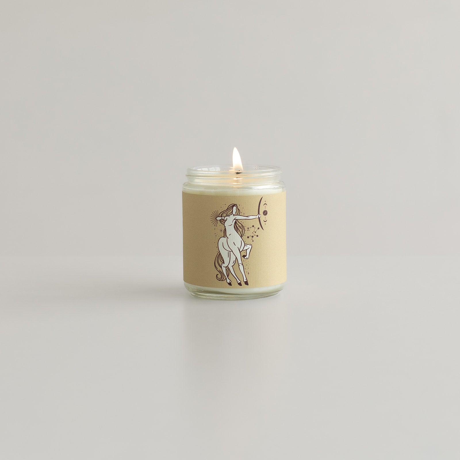 sagittarius zodiac sign the archer woman on a glass soy wax candle jar